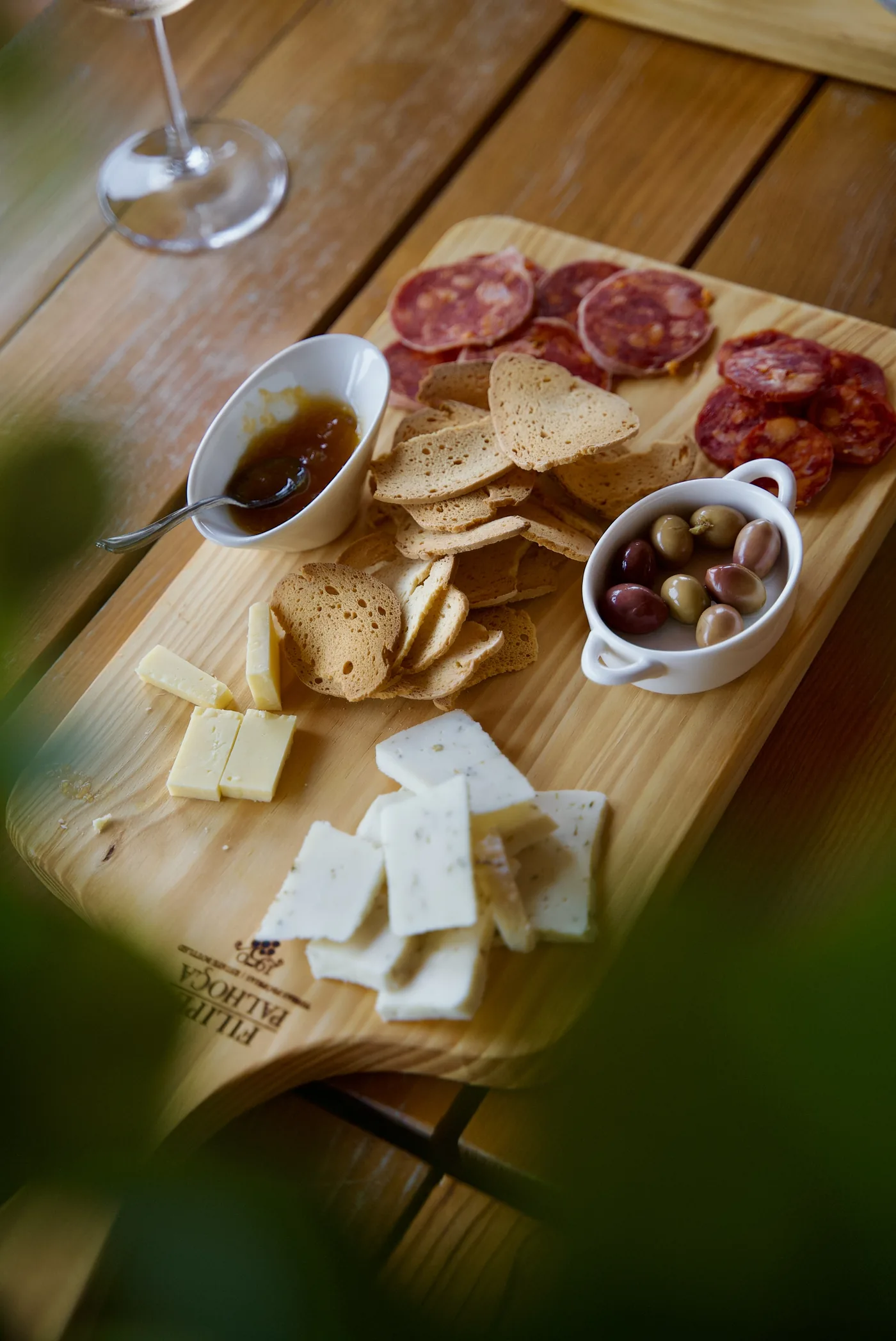 Portuguese cheeses, cured meats and olives served during a wine tasting experience in Setúbal.