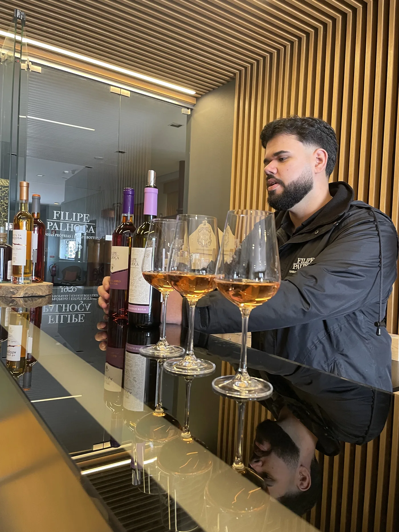 Local wine producer Pedro guiding a wine tasting experience at a family winery in Setúbal, Portugal.