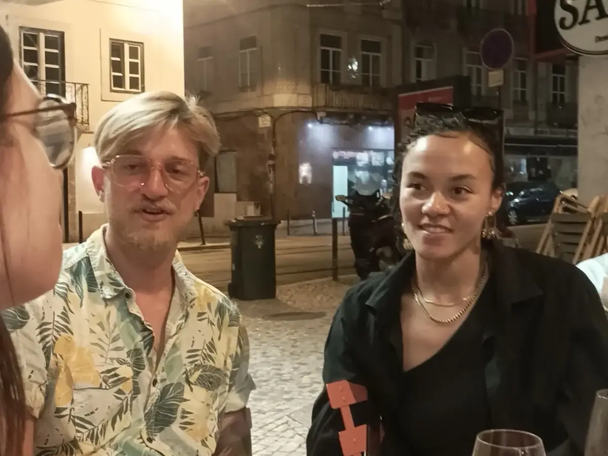 Guests enjoying Portuguese wine at a neighbourhood wine bar in Anjos Lisbon