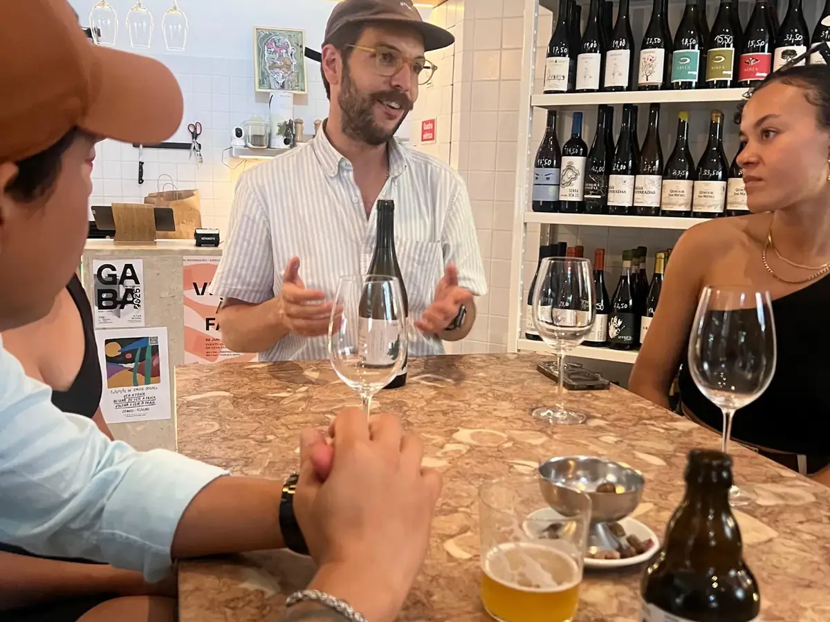 Wine host introducing natural Portuguese wines during a guided tasting in Lisbon