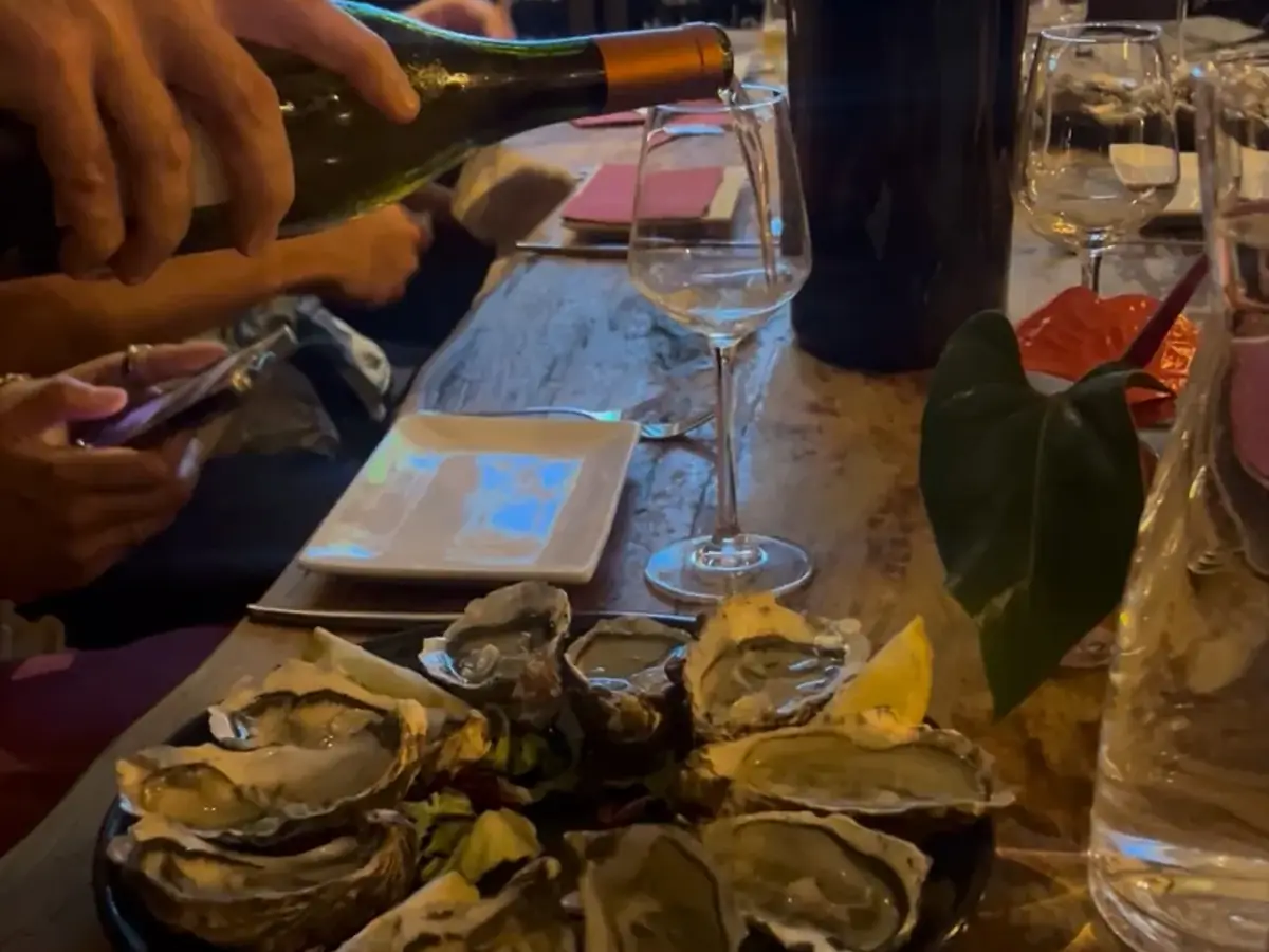 Portuguese seafood and oysters paired with sparkling wine during a Lisbon wine tasting experience