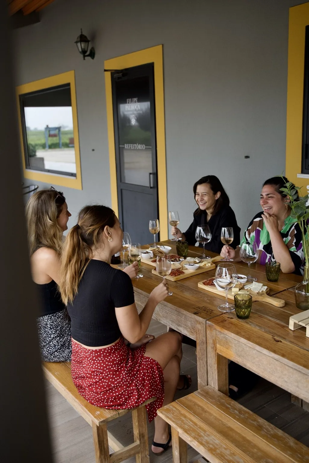 Guests enjoying a hosted wine tasting at a family winery on Portugal's Setúbal Peninsula.
